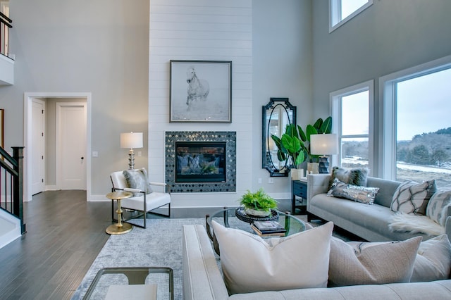 18210 102nd Pl N, Maple Grove, MN 55311 - living room with a high ceiling, wood finished floors, and a large fireplace