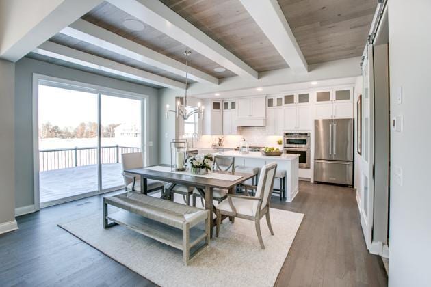18210 102nd Pl N, Maple Grove, MN 55311 - dining area with dark wood-style floors, a chandelier, and a wooden ceiling with exposed beams