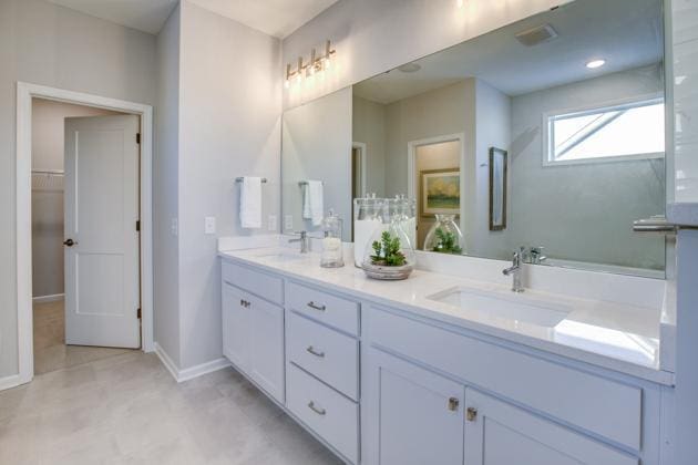 18210 102nd Pl N, Maple Grove, MN 55311 - full bathroom with double vanity and baseboards