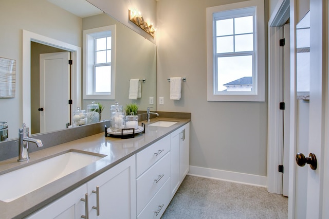 18210 102nd Pl N, Maple Grove, MN 55311 - full bathroom featuring double vanity and baseboards