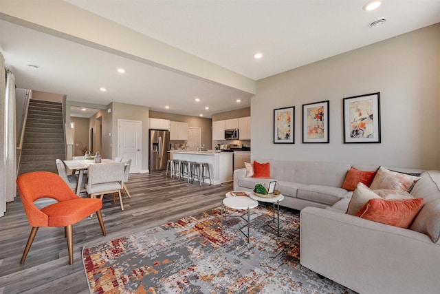 17021 Draper Way, Lakeville, MN 55044 - living area with wood finished floors, stairs, and recessed lighting