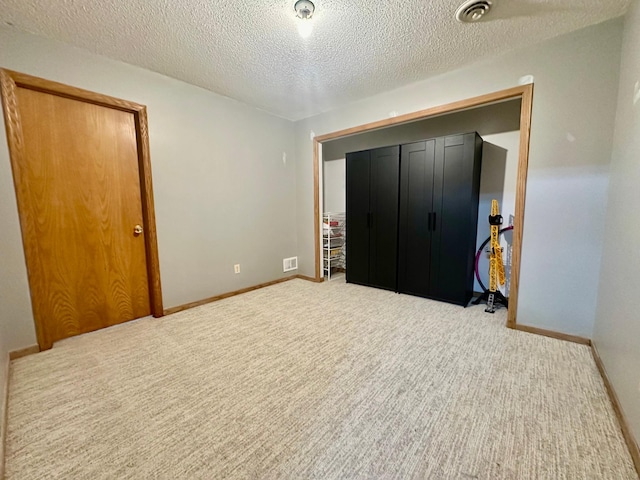 18224 Flanders St NE, East Bethel, MN 55092 - unfurnished bedroom with carpet flooring and a textured ceiling