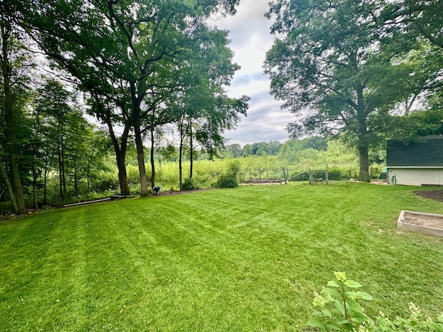 18224 Flanders St NE, East Bethel, MN 55092 - view of green lawn featuring a garden