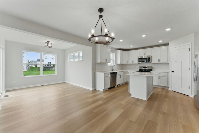 19391 Clearwater Loop, Farmington, MN 55024 - kitchen featuring stainless steel appliances, light countertops, a chandelier, light wood-style flooring, and recessed lighting