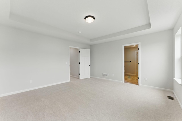 19391 Clearwater Loop, Farmington, MN 55024 - unfurnished bedroom featuring carpet flooring, ensuite bath, and a tray ceiling