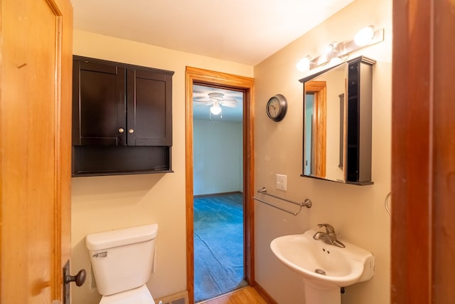 208 Lincoln St SW, Mapleton, MN 56065 - bathroom featuring toilet and ceiling fan