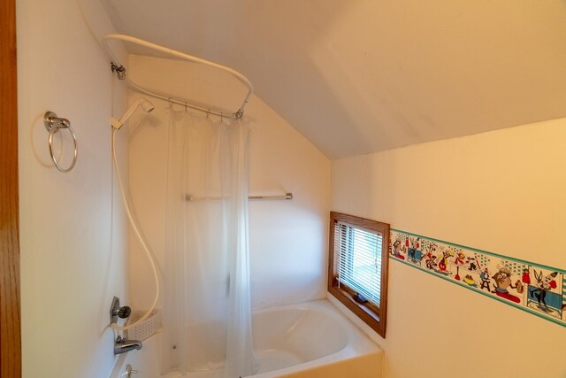 208 Lincoln St SW, Mapleton, MN 56065 - full bathroom featuring vaulted ceiling and shower / bath combination with curtain