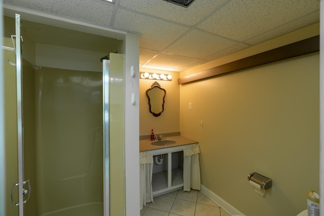 208 Lincoln St SW, Mapleton, MN 56065 - bathroom featuring a drop ceiling, tile patterned floors, and a stall shower