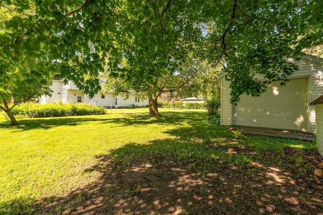 208 Lincoln St SW, Mapleton, MN 56065 - view of green lawn featuring an outbuilding and a garage