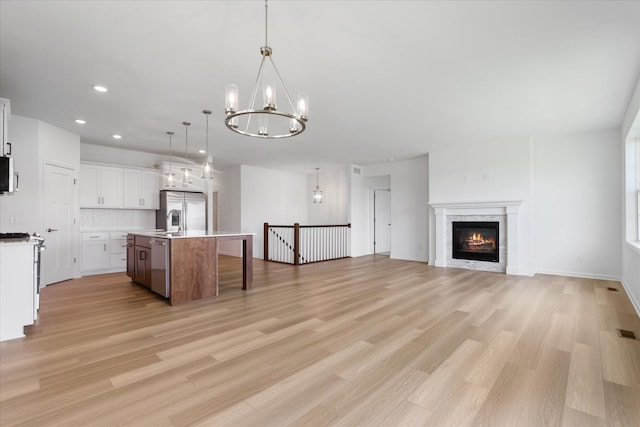 14990 144th Ave N, Dayton, MN 55327 - kitchen featuring stainless steel appliances, a chandelier, open floor plan, light countertops, and recessed lighting