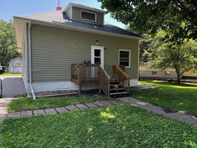 226 Central Ave, Truman, MN 56088 - rear view of property with a yard and roof with shingles