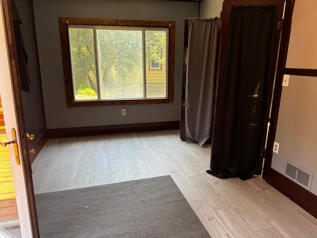 226 Central Ave, Truman, MN 56088 - unfurnished room with wood finished floors and baseboards