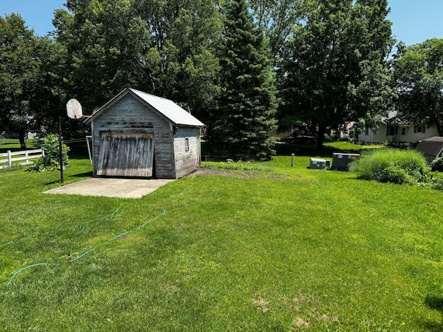 226 Central Ave, Truman, MN 56088 - view of yard with an outdoor structure and a detached garage