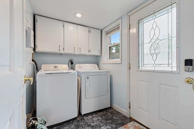 205 Main St, Marshall, MN 56258 - laundry room featuring cabinet space and washing machine and dryer