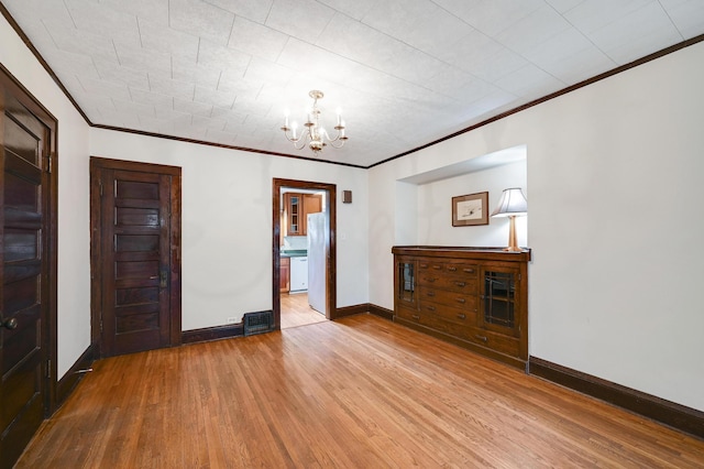 4623 Blaisdell Ave S, Minneapolis, MN 55419 - unfurnished living room with a chandelier, ornamental molding, and wood finished floors
