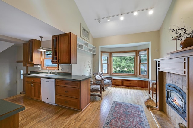 4623 Blaisdell Ave S, Minneapolis, MN 55419 - kitchen featuring white dishwasher, brown cabinets, rail lighting, dark countertops, and light wood-style flooring