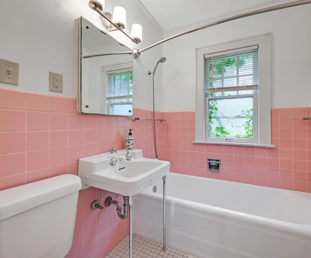 4623 Blaisdell Ave S, Minneapolis, MN 55419 - bathroom featuring tile walls, wainscoting, and tile patterned floors