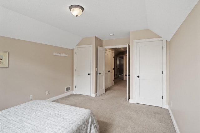 6301 France Ave S, Edina, MN 55410 - bedroom featuring light colored carpet and vaulted ceiling