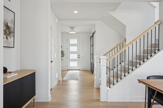2348 Kester Ave NE, Saint Michael, MN 55376 - foyer with hardwood / wood-style flooring, stairs, a barn door, and recessed lighting