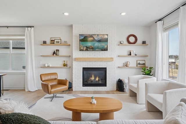 2348 Kester Ave NE, Saint Michael, MN 55376 - living area with wood finished floors, a brick fireplace, and recessed lighting
