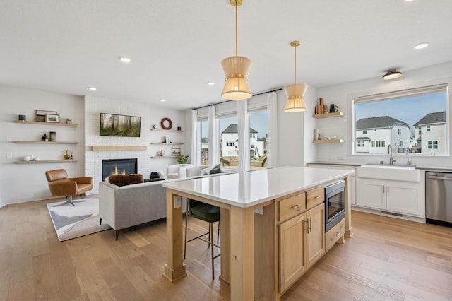 2348 Kester Ave NE, Saint Michael, MN 55376 - kitchen with appliances with stainless steel finishes, open shelves, healthy amount of natural light, light wood finished floors, and recessed lighting