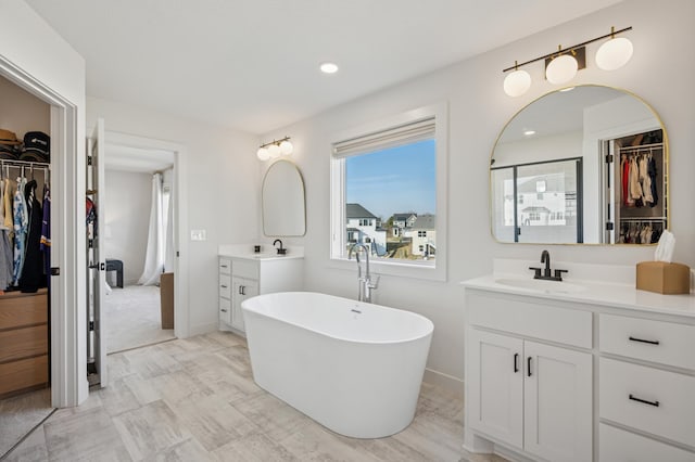 2348 Kester Ave NE, Saint Michael, MN 55376 - full bath with a walk in closet, vanity, a soaking tub, recessed lighting, and a shower stall