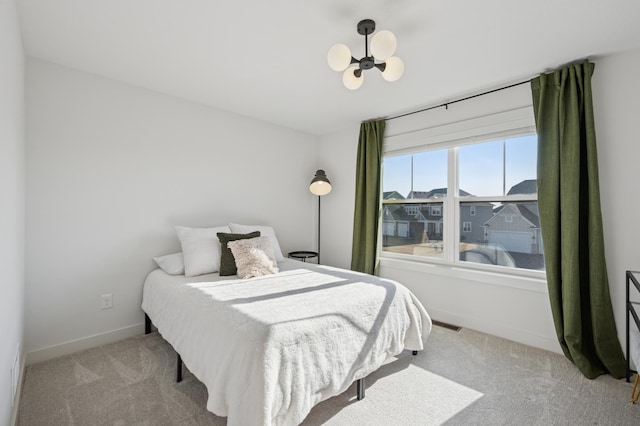 2348 Kester Ave NE, Saint Michael, MN 55376 - bedroom with light colored carpet and a chandelier