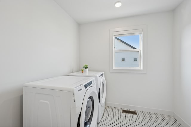 2348 Kester Ave NE, Saint Michael, MN 55376 - laundry room with washer and clothes dryer and light flooring