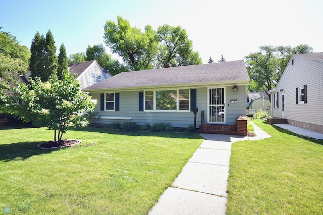 1253 3rd St N, Fargo, ND 58102 - view of front of property featuring a front lawn and roof with shingles
