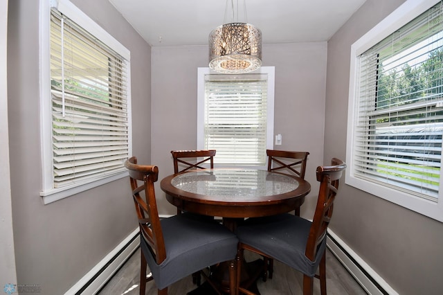 1253 3rd St N, Fargo, ND 58102 - dining room with a baseboard heating unit and wood finished floors
