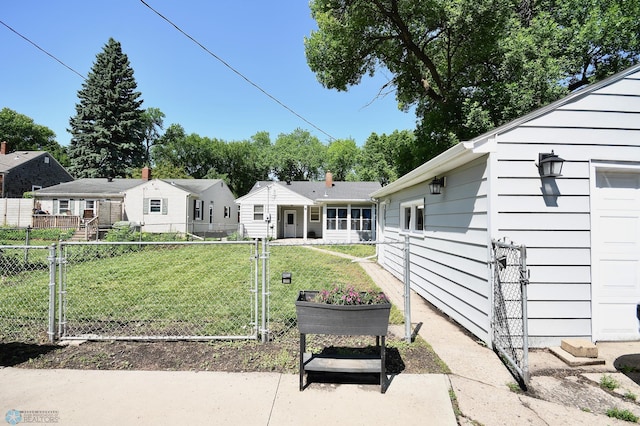 1253 3rd St N, Fargo, ND 58102 - back of house featuring a gate