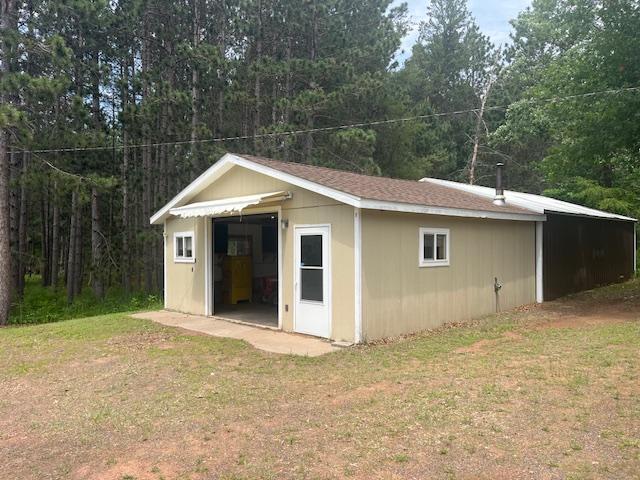 2750 330th St, Sterling Twp, WI 54840 - view of outbuilding with a view of trees
