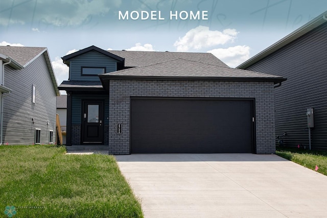 6725 Meadow View Dr S, Fargo, ND 58104 - view of front facade with brick siding, a garage, a front lawn, a shingled roof, and driveway