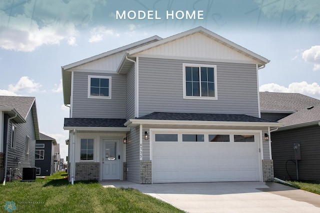 6735 Meadow View Dr S, Fargo, ND 58104 - view of front of property featuring concrete driveway, a garage, brick siding, board and batten siding, and roof with shingles