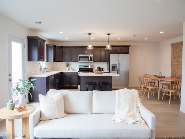 6735 Meadow View Dr S, Fargo, ND 58104 - living room with light wood-style flooring and recessed lighting