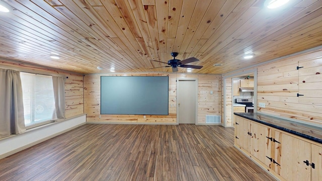 1001 3rd St SW, Crosby, MN 56441 - spare room with dark wood-style floors, a ceiling fan, wood walls, and wood ceiling