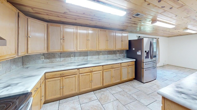 1001 3rd St SW, Crosby, MN 56441 - kitchen with stainless steel appliances, light brown cabinets, wooden ceiling, light countertops, and backsplash