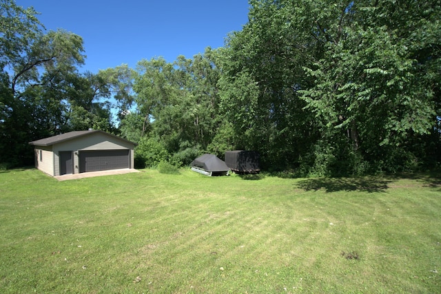 1001 3rd St SW, Crosby, MN 56441 - view of green lawn featuring a detached garage and an outdoor structure