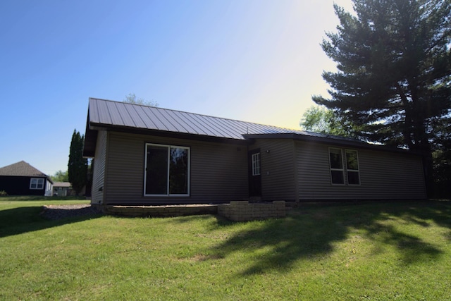 1001 3rd St SW, Crosby, MN 56441 - back of house featuring a lawn and a metal roof