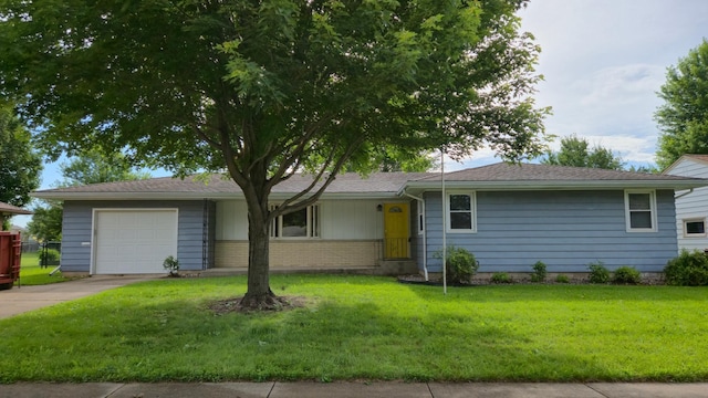 1003 15th St SW, Austin, MN 55912 - single story home with a garage, driveway, a front yard, and brick siding
