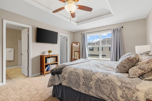 7742 Madelyn Creek Dr, Victoria, MN 55386 - bedroom with a tray ceiling, light carpet, ceiling fan, and ensuite bathroom