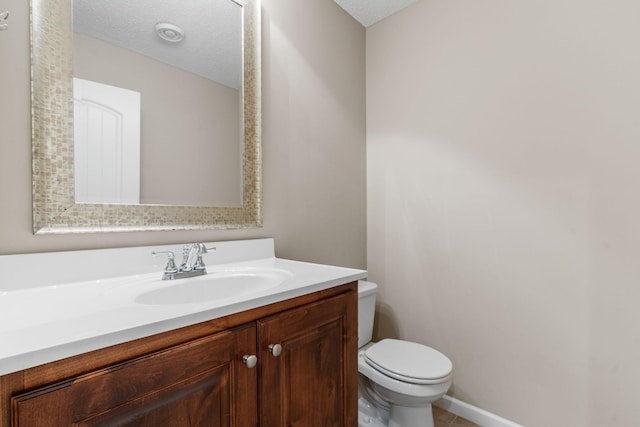 7742 Madelyn Creek Dr, Victoria, MN 55386 - half bathroom featuring vanity, a textured ceiling, and tile patterned floors
