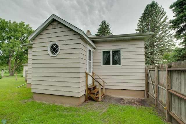 604 2nd Ave S, Kindred, ND 58052 - rear view of house with entry steps and a chimney
