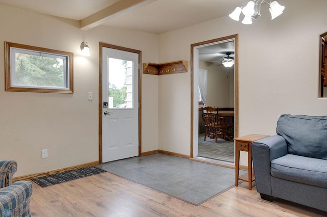 604 2nd Ave S, Kindred, ND 58052 - foyer entrance featuring a chandelier, light wood finished floors, and beam ceiling