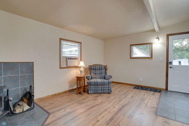 604 2nd Ave S, Kindred, ND 58052 - living area featuring light wood finished floors, beam ceiling, and cooling unit