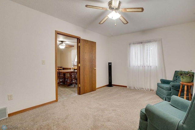 604 2nd Ave S, Kindred, ND 58052 - living area with a ceiling fan and light colored carpet