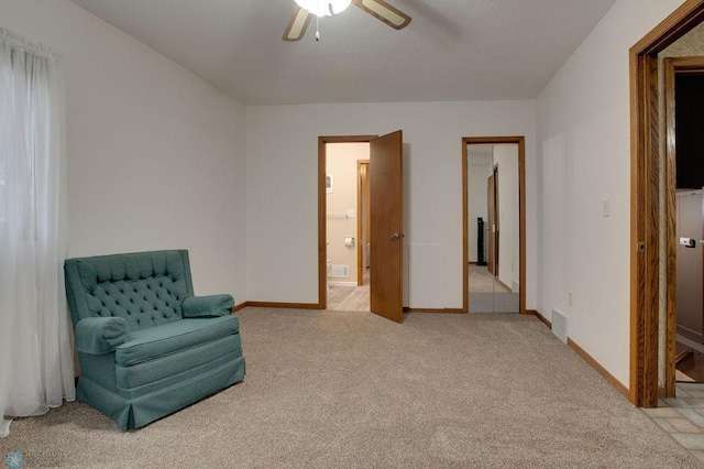 604 2nd Ave S, Kindred, ND 58052 - living area featuring ceiling fan and light colored carpet