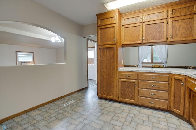 604 2nd Ave S, Kindred, ND 58052 - kitchen with brown cabinets, light countertops, and healthy amount of natural light