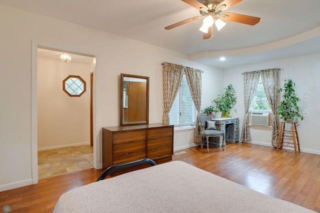 604 2nd Ave S, Kindred, ND 58052 - bedroom with cooling unit, wood finished floors, and a ceiling fan
