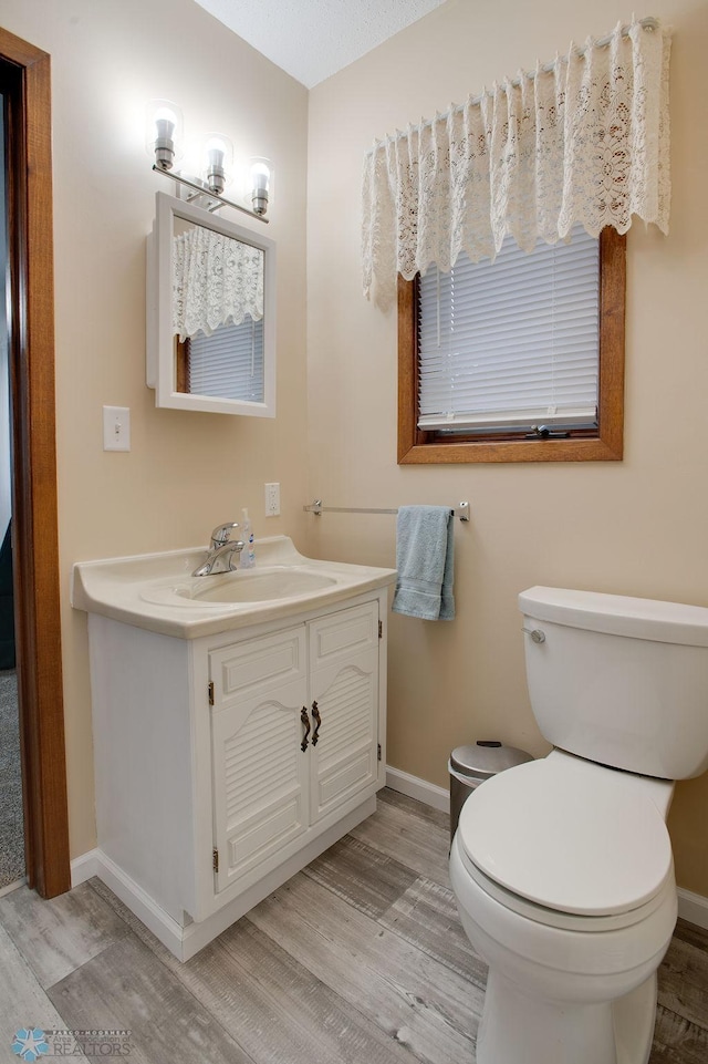 604 2nd Ave S, Kindred, ND 58052 - half bathroom featuring wood finished floors and vanity